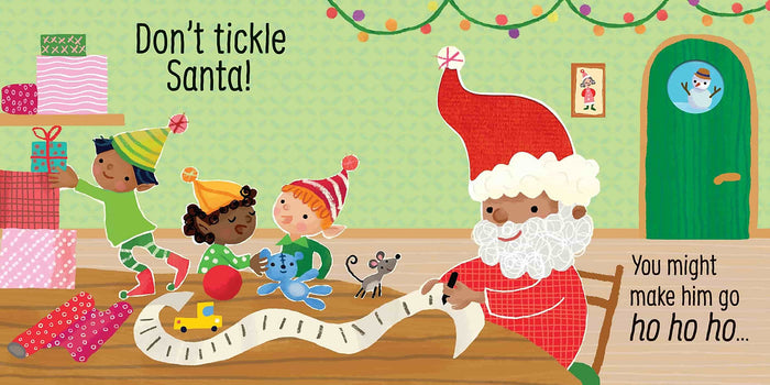 Diverse Santa writing a long list with elves, gifts, and a mouse in a colorful, festive green room with lights.