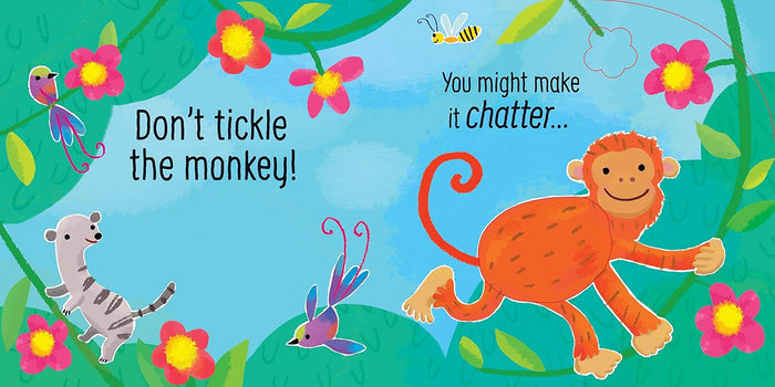 Colorful book illustration of a smiling orange monkey, a lemur, and birds in a bright jungle with pink flowers.