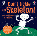 Smiling white cartoon skeleton on navy blue book cover with green grass, orange pumpkin, and soft patches for sounds.