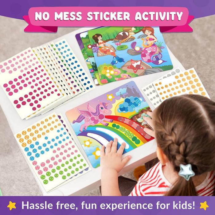A child places colorful dot stickers onto vibrant unicorn and mermaid scene boards on a white table.