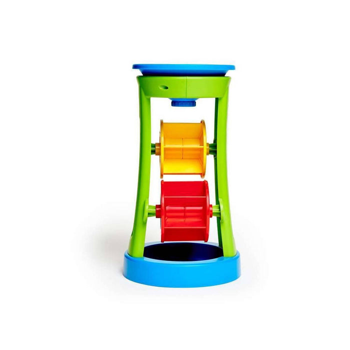 Colorful plastic toy tower with a blue funnel, green frame, and stacked yellow and red spinning wheels.