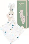 Cream plush rabbit attached to a blue dragonfly print blanket, shown next to a tall sage green Kaloo gift box.