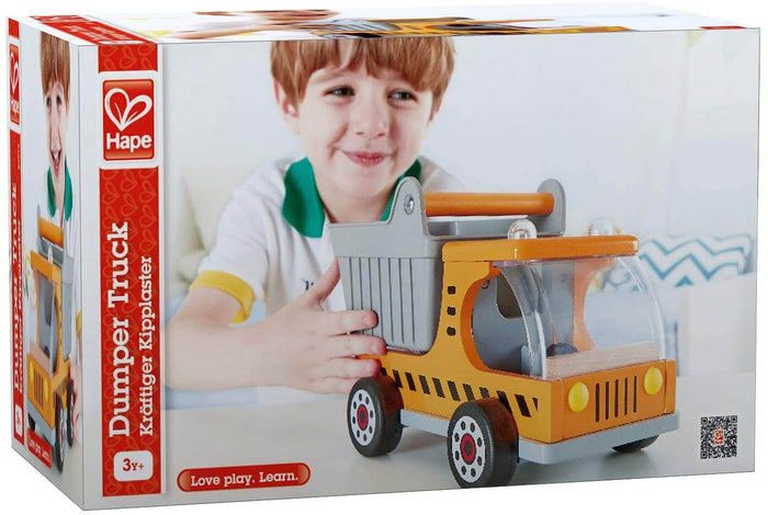 Box for Hape orange wooden dumper truck with grey bucket and black wheels, shown with a smiling young boy.