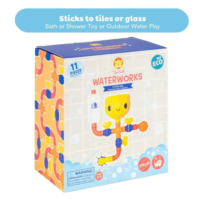 Bath toy box with colorful graphics of orange and blue pipes, a yellow smiling funnel, and a spinning water wheel.