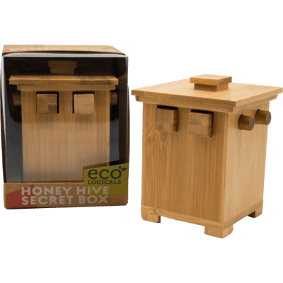 Bamboo wooden puzzle box with square and cylindrical pegs, shown next to its windowed retail packaging.