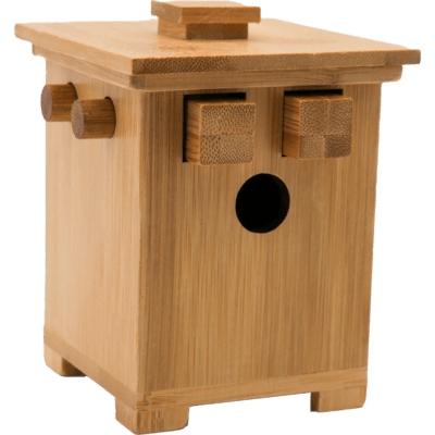 Rectangular bamboo puzzle box with sliding square blocks, round side pegs, and a circular hole in the center.
