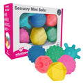 Six colorful sensory balls with various textures like bumps and spikes, shown inside and outside their product box.