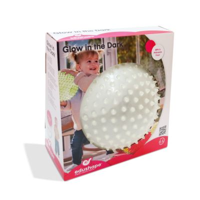 White spiky ball in pink and white packaging featuring a toddler and text that says Glow in the Dark.