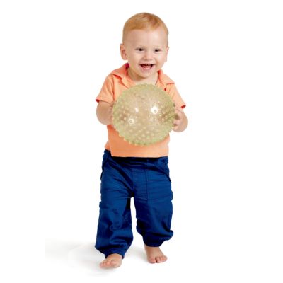 Smiling toddler holding a large, translucent yellow-green ball covered in small textured nubs.