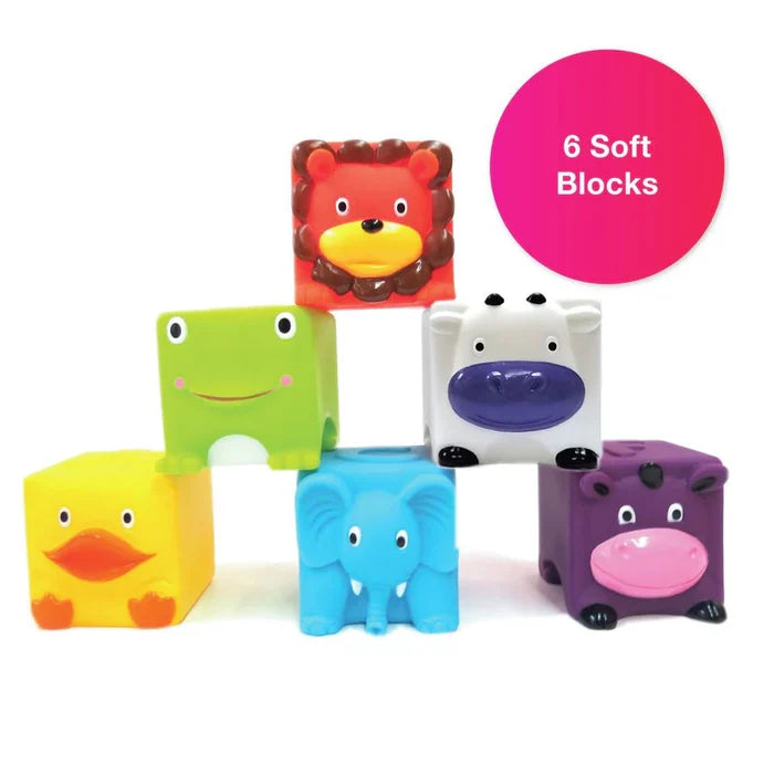 Six soft animal blocks in a pyramid: yellow duck, blue elephant, purple hippo, green frog, white cow, and orange lion.
