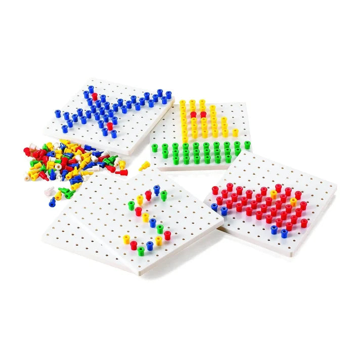 Four white square pegboards with colorful pegs forming an airplane and number 5, plus a pile of extra multicolored pegs.