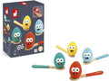 Four colorful wooden eggs with cartoon faces on matching spoons, shown alongside their Janod product packaging.