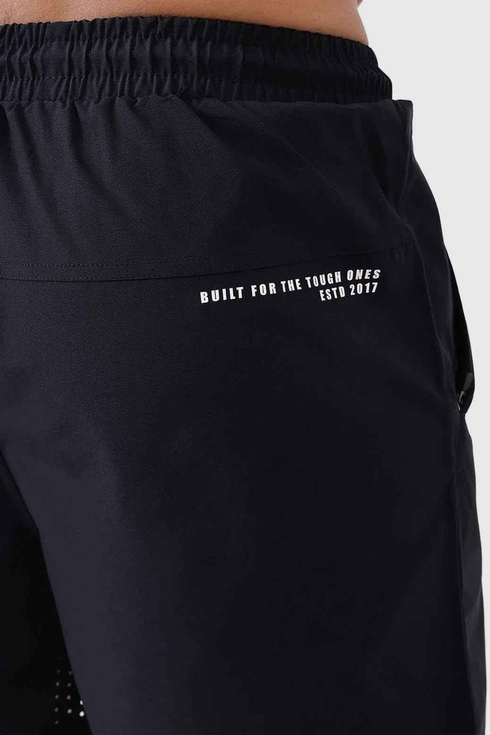 Black Nova Shorts by Fuaark Nz laid flat, showcasing their stylish design and comfortable fit in a casual fashion setting.