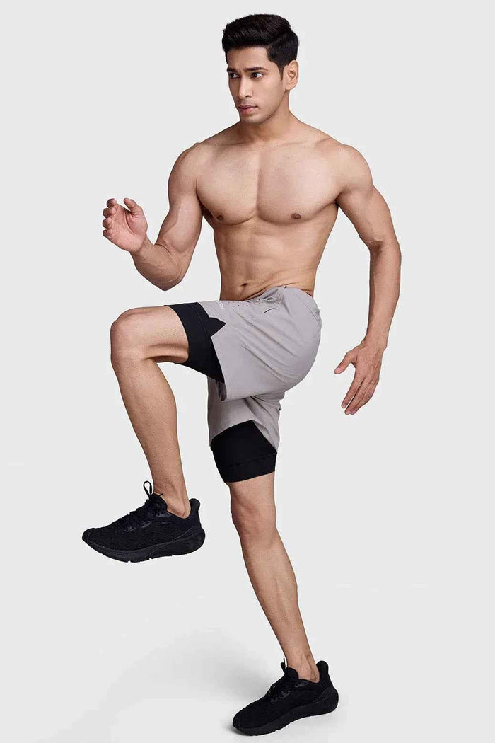 Fuaark Nz men's 2-in-1 laser workout shorts in beige and black, featuring a comfortable and stylish athletic design.