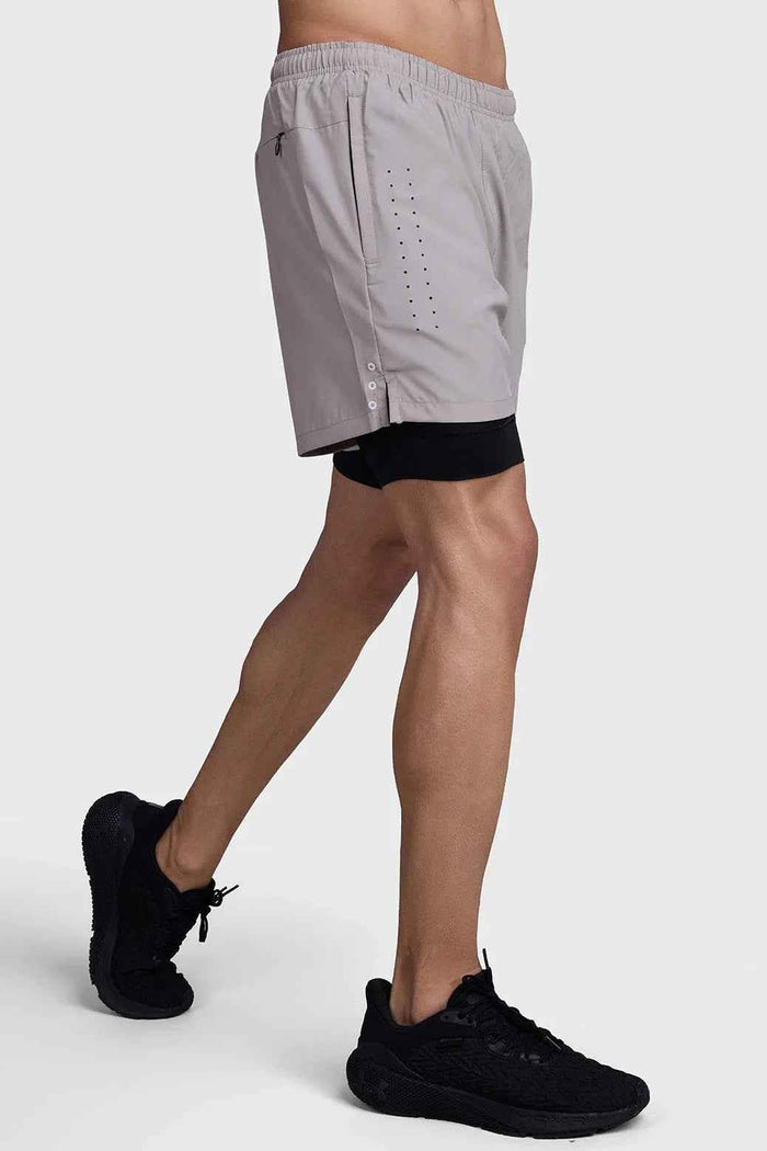 Fuaark Nz men's 2-in-1 laser shorts in beige and black, designed for active workouts with a sleek, sporty look.