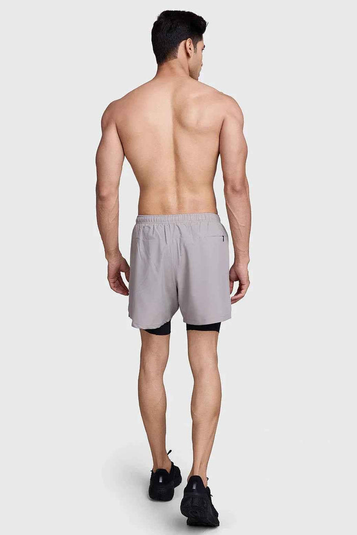 Fuaark Nz men's 2-in-1 laser shorts in beige and black, designed for active workouts with comfortable athletic fit.