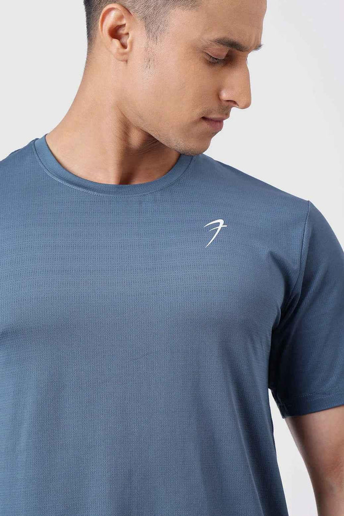 Fuaark NZ Ember Light Blue running T-shirt for ultimate performance, showing a fitted athletic T-shirt with moisture-wicking fabric.