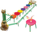 Motorized wooden marble run with a spiral lift, green rails, and seven colorful pads for bouncing marbles.