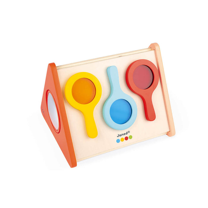 Wooden triangular sensory toy with yellow, blue, and red mirror shapes and an orange side panel with a mirror.