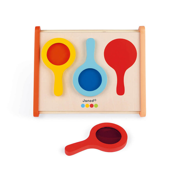 Wooden toy tray with yellow, light blue, and red paddle-shaped mirrors and one separate red handheld mirror.