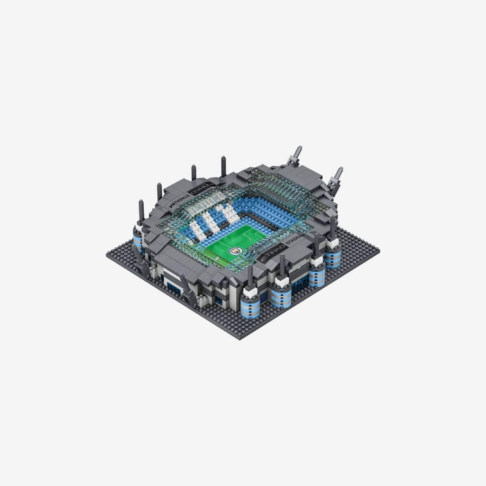 Miniature building block Etihad Stadium with light blue seats, a green field, and grey masts on a dark grey base.