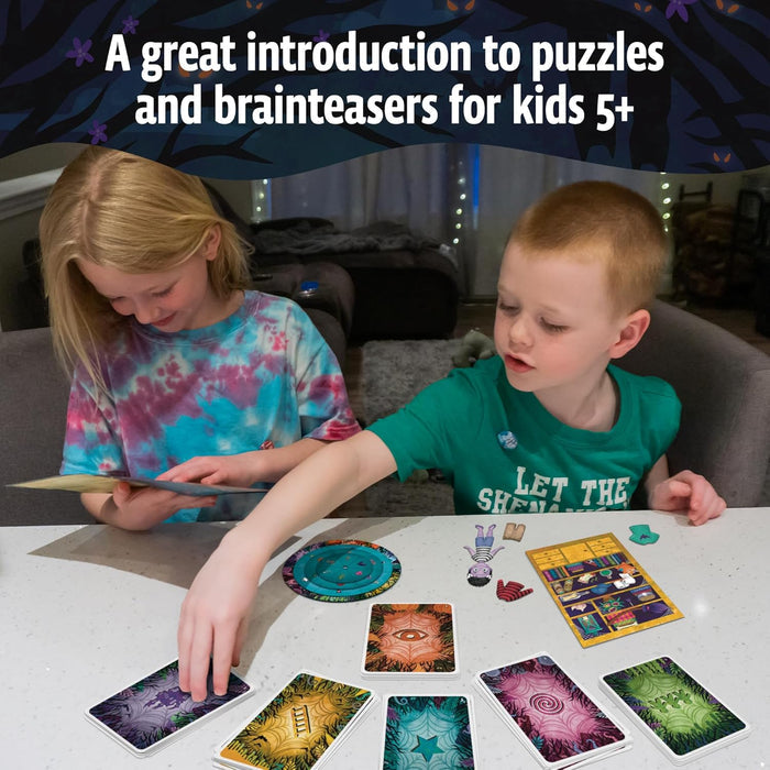 Two children play a puzzle game with colorful cards, a circular decoder wheel, and character cutouts on a white table.