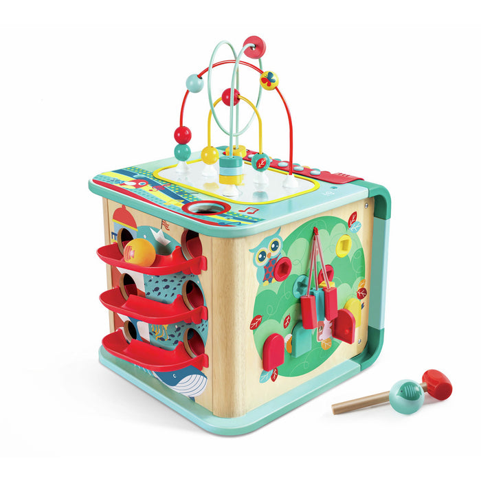 Teal and wood activity cube with a bead maze, ball ramps, and forest scene. Includes a small toy mallet.