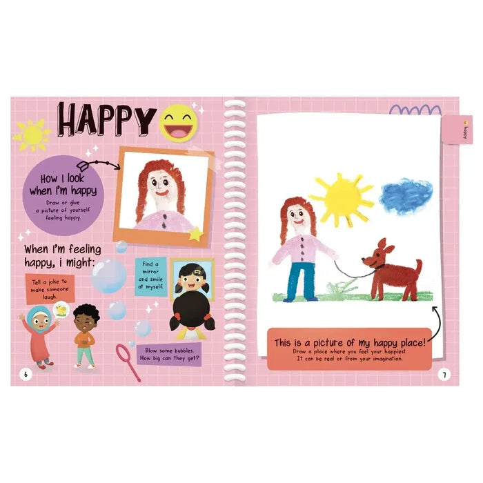 Open pink journal spread titled HAPPY with child-like drawings of a smiling person and a happy place with a sun and dog.