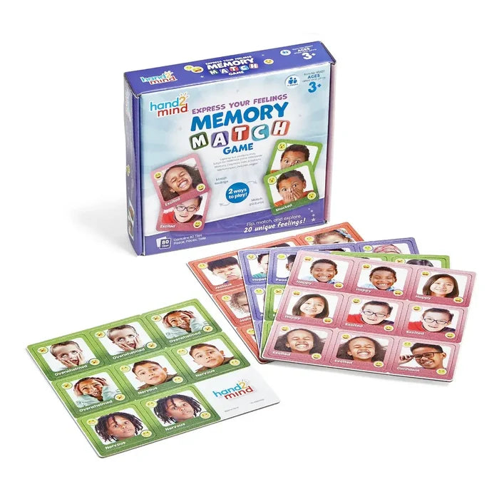 Memory game box with colorful square tiles featuring photos of diverse children expressing different emotions.