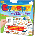 Colorful Eye Spy game box showing a hand holding the letter F card over a collage of small illustrated objects.