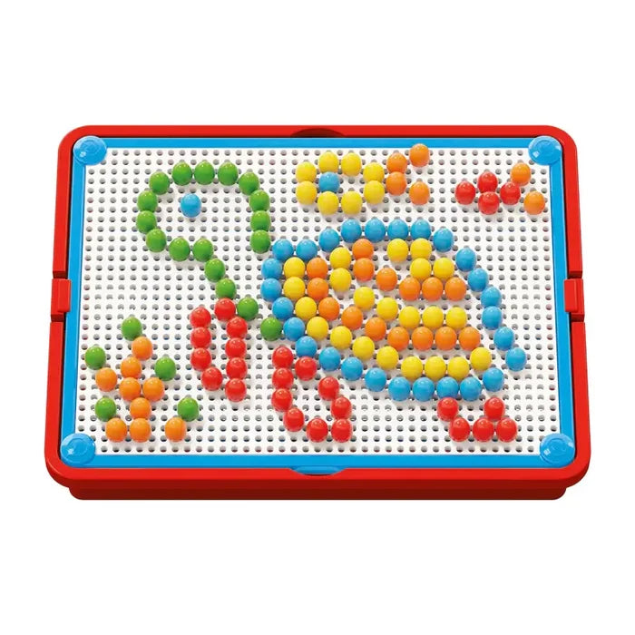 Colorful plastic pegs form a turtle mosaic on a white peg board within a red and blue rectangular frame.