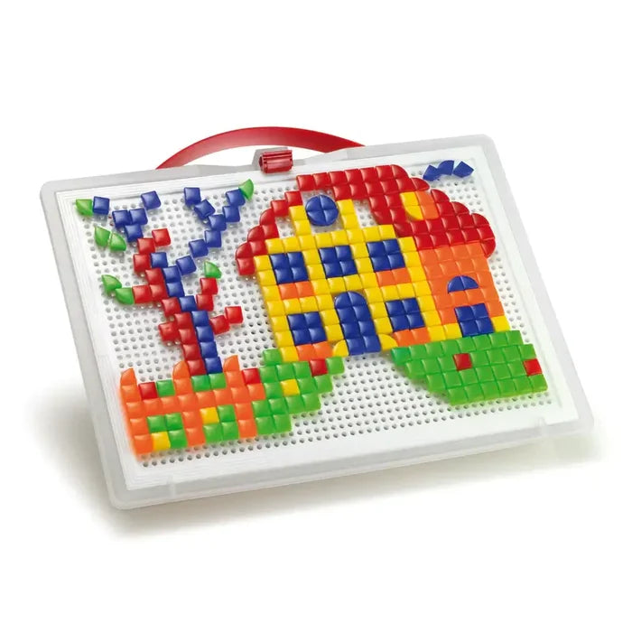 White portable pegboard with a red handle and a mosaic house and tree made from small colorful square and triangle pegs.