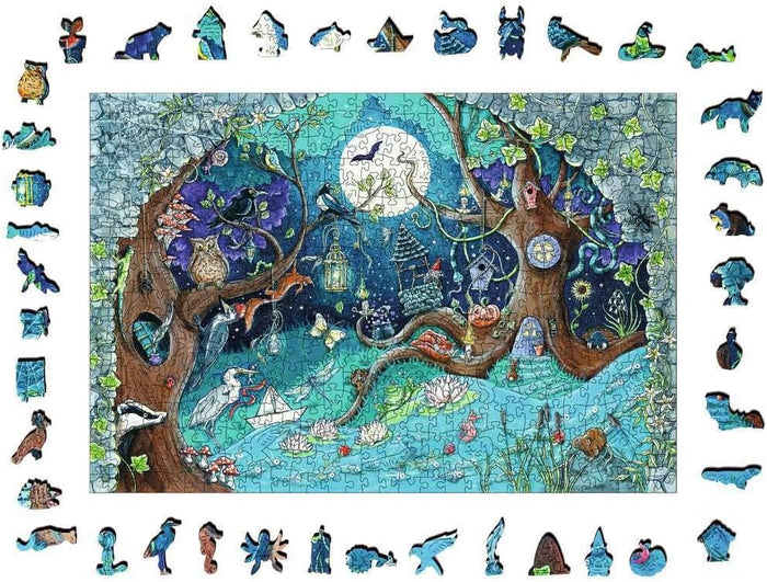 Moonlit fantasy forest wooden puzzle with animal-shaped whimsie pieces bordering a scene of trees, a pond, and wildlife.