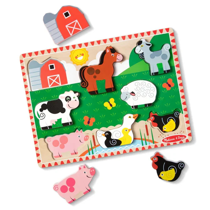 Colorful wooden farm puzzle with thick animal pieces like a cow and horse, with a pig and barn piece resting nearby.