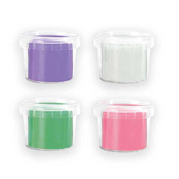 Four clear plastic tubs of purple, pale grey, green, and pink dough arranged in a two-by-two grid.