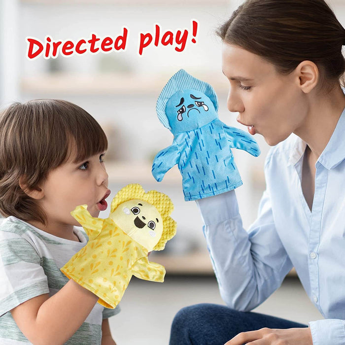 A woman and child use blue and yellow plush hand puppets to express emotions during directed play.