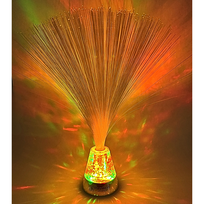 Glowing fiber optic lamp with orange strands fanning out from a sparkling, multi-colored glitter base.