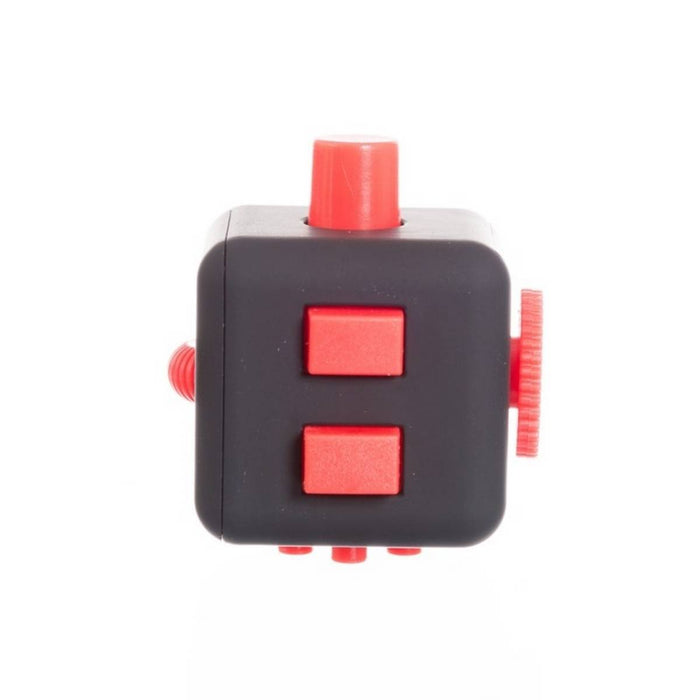 Dark gray cube toy with bright red buttons, a rotating wheel, and switches on a plain white background.