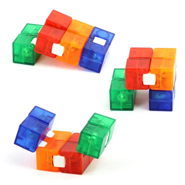 Translucent red, orange, blue, and green folding blocks shown in three different interlocking configurations.