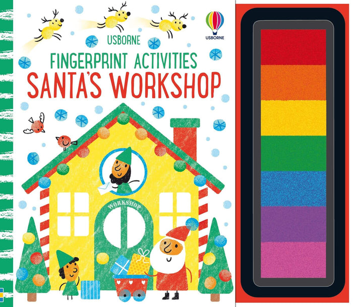 Santa's Workshop fingerprint book with a yellow house cover and an attached seven-color rainbow ink pad.