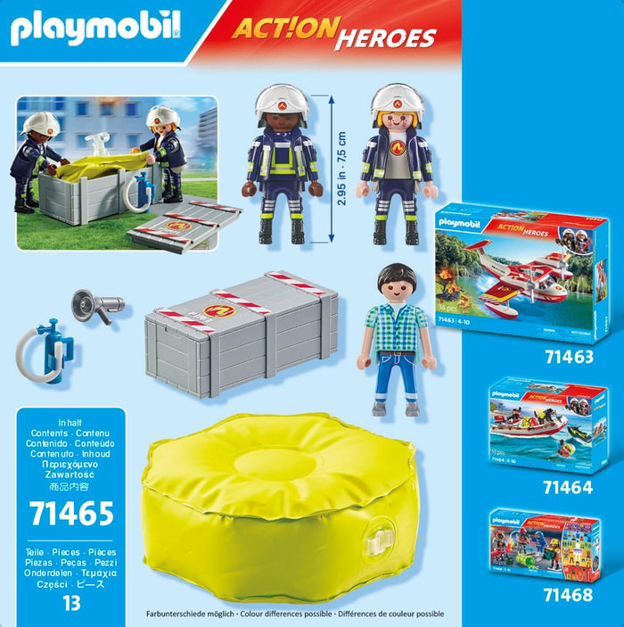 Playmobil Action Heroes set with two firefighter figures, a boy, large round yellow air pillow, and grey crate.
