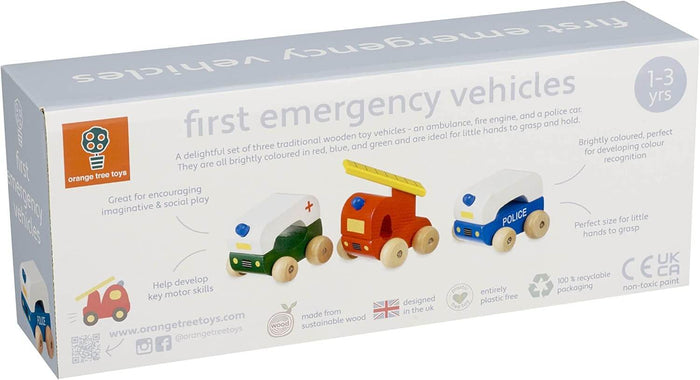 Box showing three wooden toys: a red fire engine, blue and white police car, and green and white ambulance.