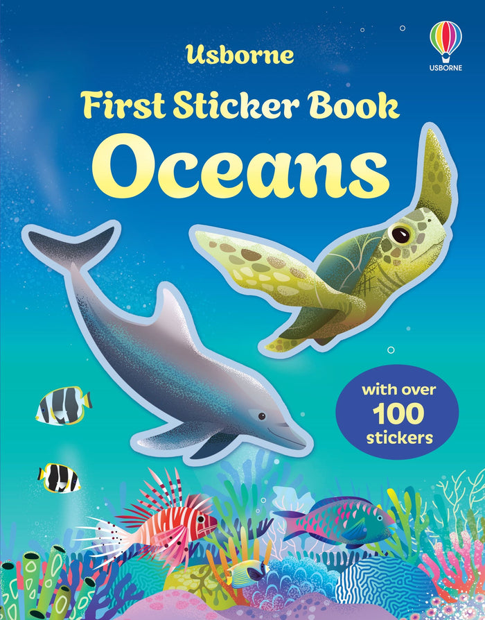 Blue book cover featuring a dolphin, sea turtle, and tropical fish swimming above a vibrant underwater coral reef.