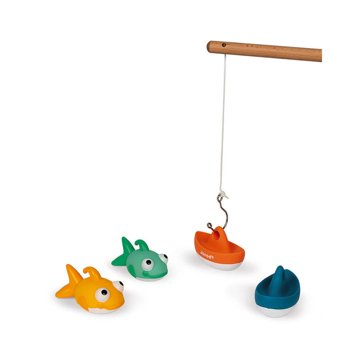 Wooden toy rod hooked to an orange boat, with yellow fish, green fish, and blue boat figures on a white background.