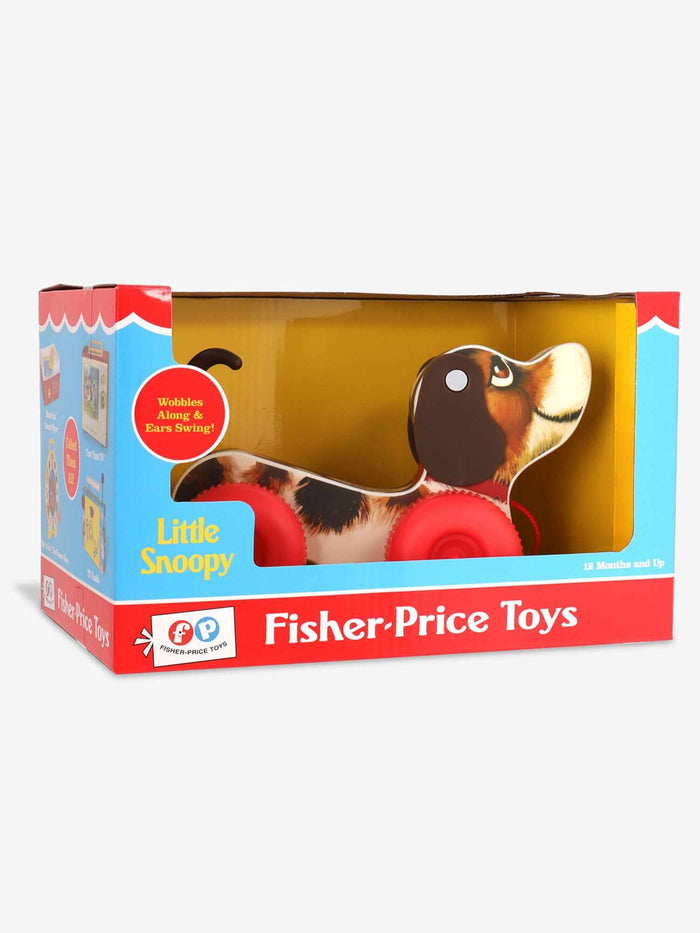 Spotted toy dog with floppy ears and large red wheels in a red, white, and blue vintage-style display box.