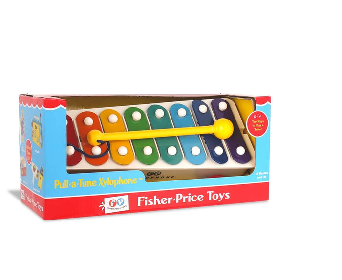 Toy xylophone with 8 rainbow-colored bars and a yellow mallet in its red and blue Fisher-Price display box.