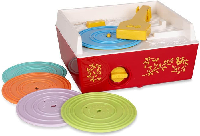 Red and white toy record player with yellow arm and five colored records: blue, green, purple, orange, and teal.