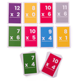 Vibrant multiplication flashcards with white numbers on colorful backgrounds, shown in two rows and two stacked decks.