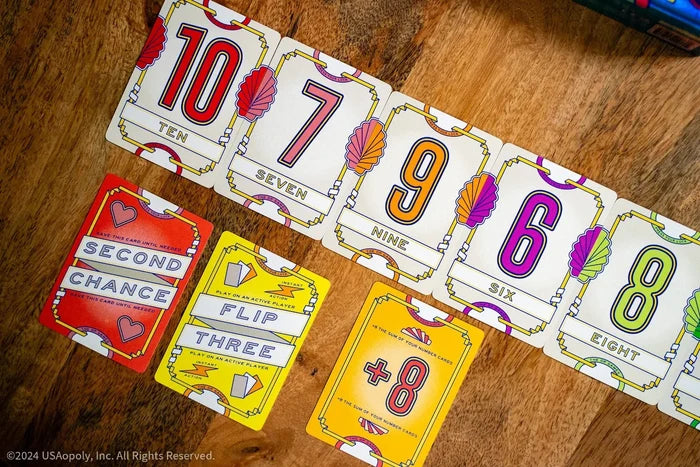Vibrant Art Deco game cards featuring numbers 10, 7, 9, 6, 8 and action text on a rustic wooden background.