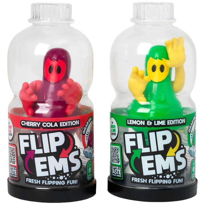 Two toy bottles with purple and green figures inside clear domes, labeled Flip Ems Cherry Cola and Lemon & Lime.